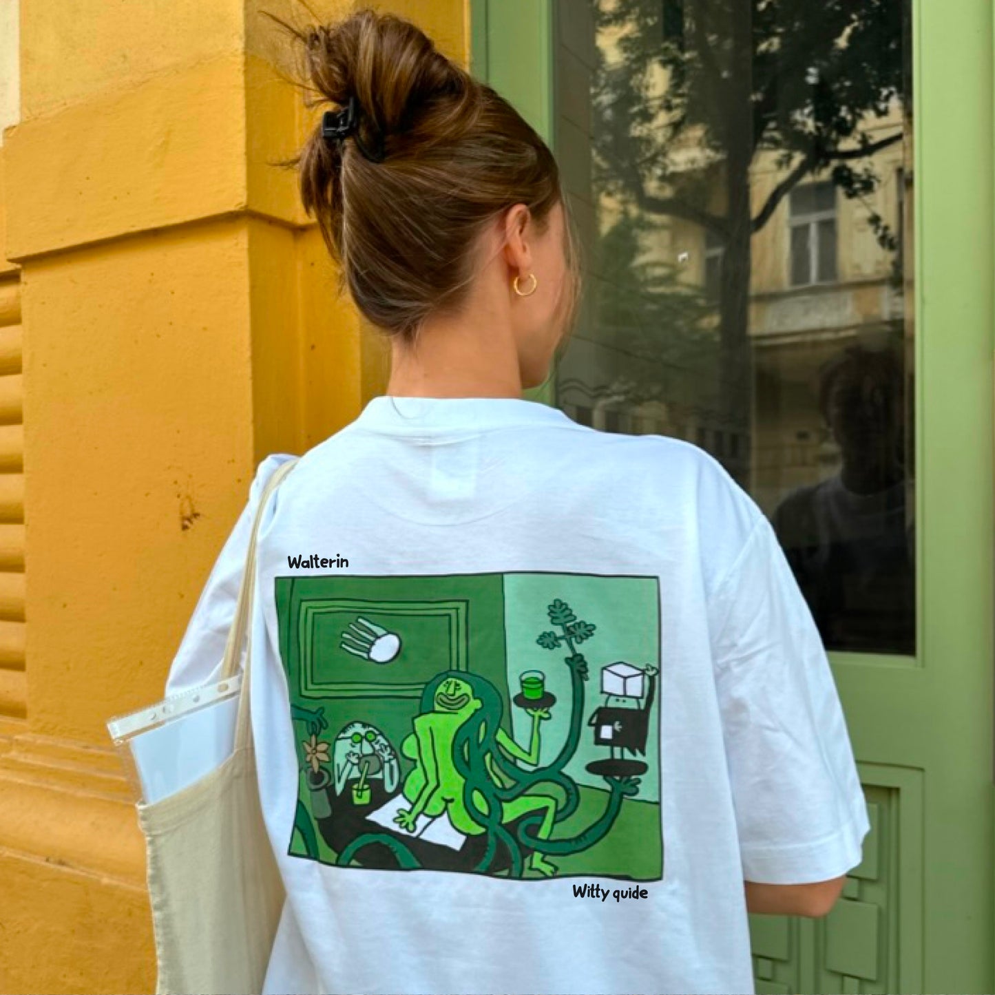 Walterin Prague T-shirt with full comic-style illustration of the absinth drinker and green fairy on the back